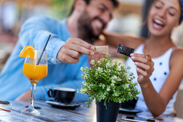 Wall Mural - Young couple have fun in cafe