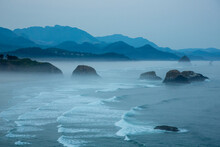 Indian Beach On Ecola State Park With Mist Over Waves Breaking At Dawn.