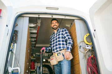 Portrait of an electrician happy worker at work