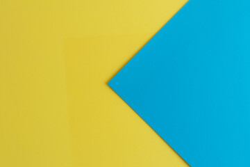 Closeup of a yellow and blue surface with space for text