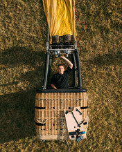 Aerial View Of Man Standing In Hot Air Balloon Basket Gondola, Creative Selfie.