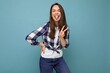 © Ivan Traimak - Photo shot of cute nice charming gorgeous attractive pretty youngster happy woman wearing stylish clothes isolated over colorful background with copy space and showing tongue and peace gesture