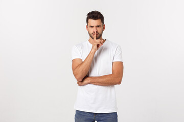 Wall Mural - Close up portrait of disappointed stressed bearded young man in shirt over white background.