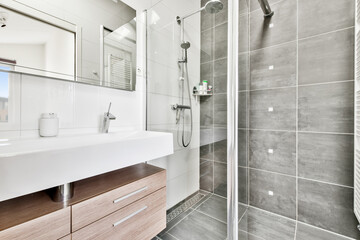 Modern shower stall in a bright bathroom