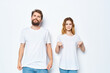 © SHOTPRIME STUDIO - young couple in white t-shirts and jeans Friendship on emotions mockup