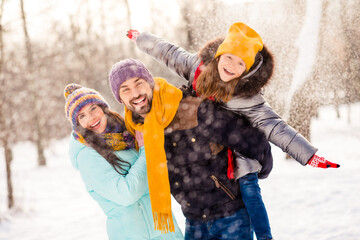 Poster - Photo of excited family happy positive smile mommy daddy daughter piggyback hands wings fly snow vacation outdoors