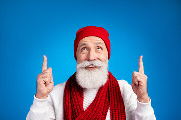 Sticker - Portrait of positive man look direct two arms fingers up empty space promotion isolated on blue color background