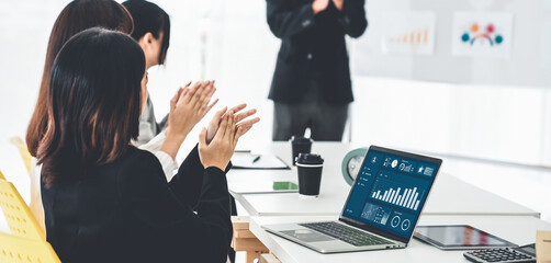 Poster - businesswoman in business meeting using laptop computer proficiently at office for marketing data an