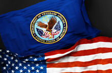 Flag of the United States Department of Veterans Affairs along with a flag of the United States of America as a symbol of a connection between them, 3d illustration