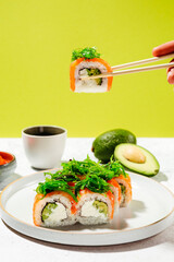 Wall Mural - Japanese sushi rolls with salmon, shrimp, smoked eel and red caviar