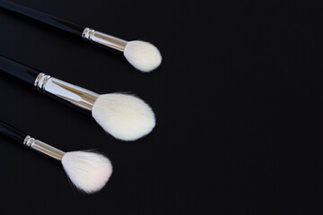 makeup brushes on colored backgrounds. View from above