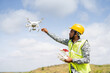 © WESTOCK - Drone Pilot safely receiving drone using remote controller - Concept of return to home, aerial survey using UAV technology