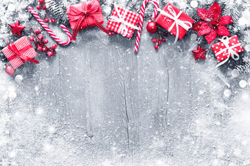 Wall Mural - christmas and new year background with fir branches, gift boxes, ornament and snowfall