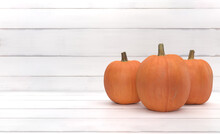 Group Of Orange Pumpkin Over White Wood Background. Halloween And Thanksgiving