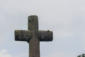 Stone cross on a grave in a Christian cemetery