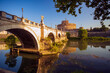 Along the banks of the Tiber River in Rome. Ancient bridges