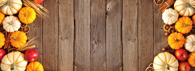 Aufkleber - Fall double side border of pumpkins, apples and spices. Above view on a rustic dark wood banner background with copy space.