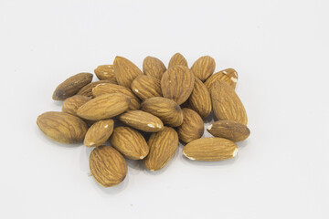 Wall Mural - Bunch of brown almonds with a white background