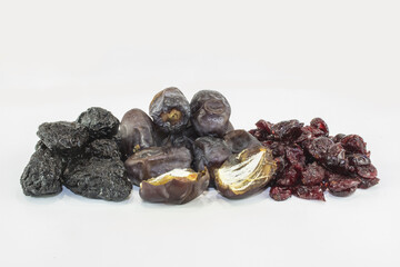 Sticker - Bunch of different types of dried fruits with a white background