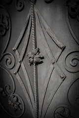 Wall Mural - Vertical image of forged metal elements that adorn the gate