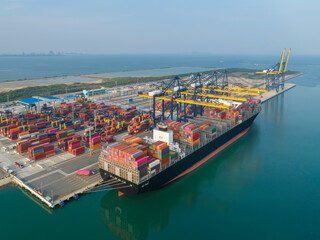 aerial view of ship cargo containers entering to modern harbor with export and import business and l