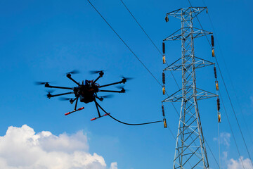 drone stringing transmission lines of electrical high power. stringing via our method reduces cost a