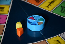 Pieces Of A Colorful Puzzle Board Game In Which The Player Collects Parts Of A Pie