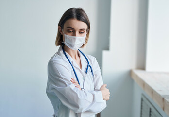 Wall Mural - nurse in white coat medical mask hospital