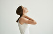 © SHOTPRIME STUDIO - brunette in white t-shirt joint pain health problems dissatisfaction
