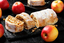 Traditional homemade apple strudel with caramelized apples and raisins.
