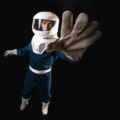 Wall Mural - An astronaut in weightlessness reaches up with his hand.