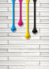 Wall Mural - cmyk ink drops on white wooden background