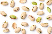 Flat Lay Of Pistachio Nuts On A White Background.