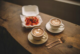Fototapeta Mapy - coffee and strawberries / two cups of coffee