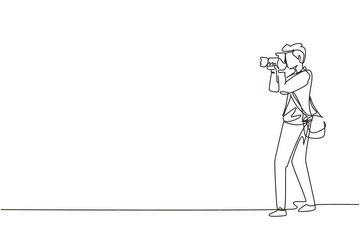 Poster - Single continuous line drawing photographer holding photo camera and photographing. Creative profession or occupation. Happy male take photo shot. One line draw graphic design vector illustration