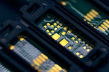 Canvas Print - Macro shot of a black electronic circuit board with its small details