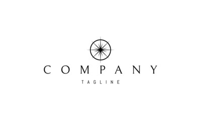 Wall Mural - vector logo on which an abstract image of a bright star in a circle in the form of a compass.