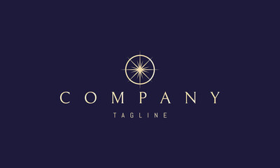 Wall Mural - vector golden logo on which an abstract image of a bright star in a circle in the form of a compass.
