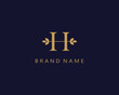 gold initial letter H logo. luxury and elegant
