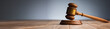 Judge gavel on wooden table.