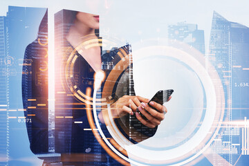 Poster - Businesswoman wearing formal suit is holding smartphone in her h