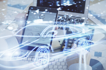 Poster - Double exposure of man's hands holding and using a digital device and automobile theme hologram drawing. Technology concept.