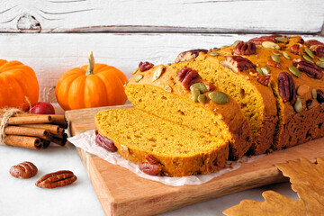 Aufkleber - Fall pumpkin bread. Slices close up against a white table scene background.