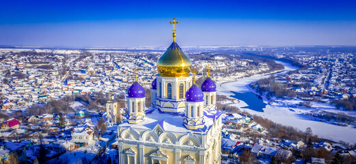 Wall Mural - The main cathedral of the city of Yelets, the Ascension Cathedral, rises above the ancient Russian city on a winter evening during sunset