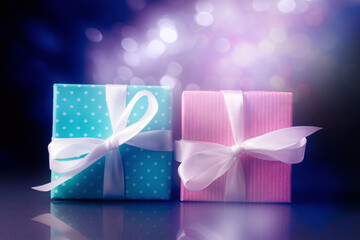 Wall Mural - Pink and blue gift boxes over holiday lights