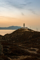 Lighthouse on the Coastline at Sunset in Mykonos Greece