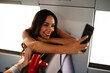 © Jelena - Young woman travelling by train. Beautiful girl having video call