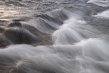 Poster - abstract background from long exposure of water stream in a mountain river close-up