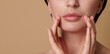 © Taras Grebinets - Close-up cropped beauty face portrait of beautiful European woman touching her perfect clean fresh and shiny skin near her lips. Skin care, cosmetology, SPA concept on beige background, copy space