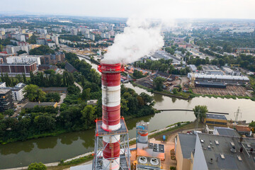 Wall Mural - Industrial area of Wroclaw - smoke comes out of the chimneys of the power plant. View from the top, in the evening